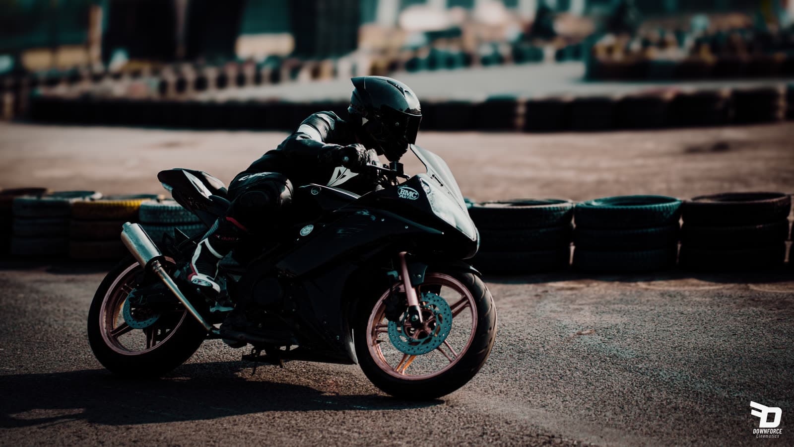 Blacked-out sportbike parked trackside